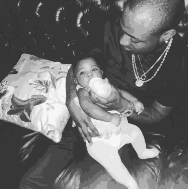 Photo: Davido Does The Woman Job By Feeding His Baby